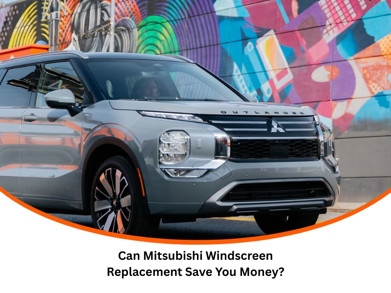 Mitsubishi Windscreen Replacement for a silver Outlander SUV parked near a colourful street mural