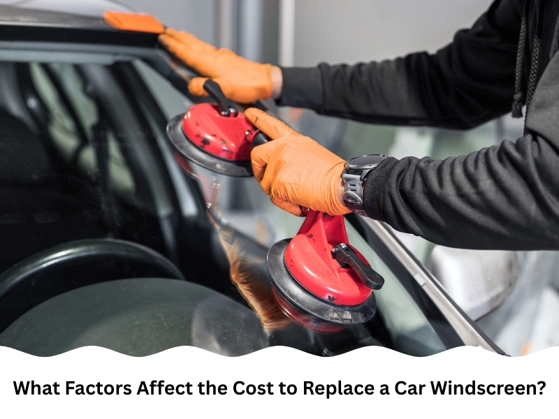 Technician using suction tools to lower glass, impacting cost to replace car windscreen